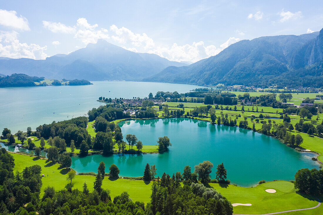 Austria, Salzburg, Aerial view of Mondsee lake and golf course