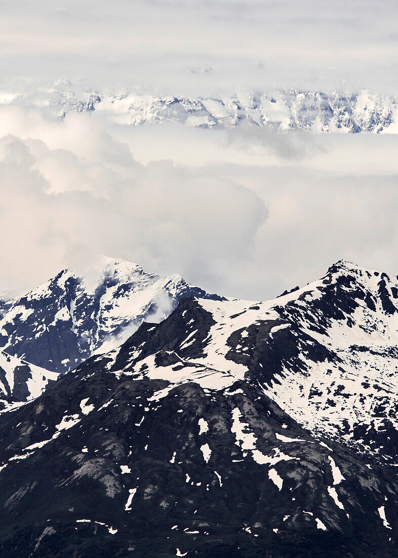 USA, Alaska, Clouds above snowy mountains