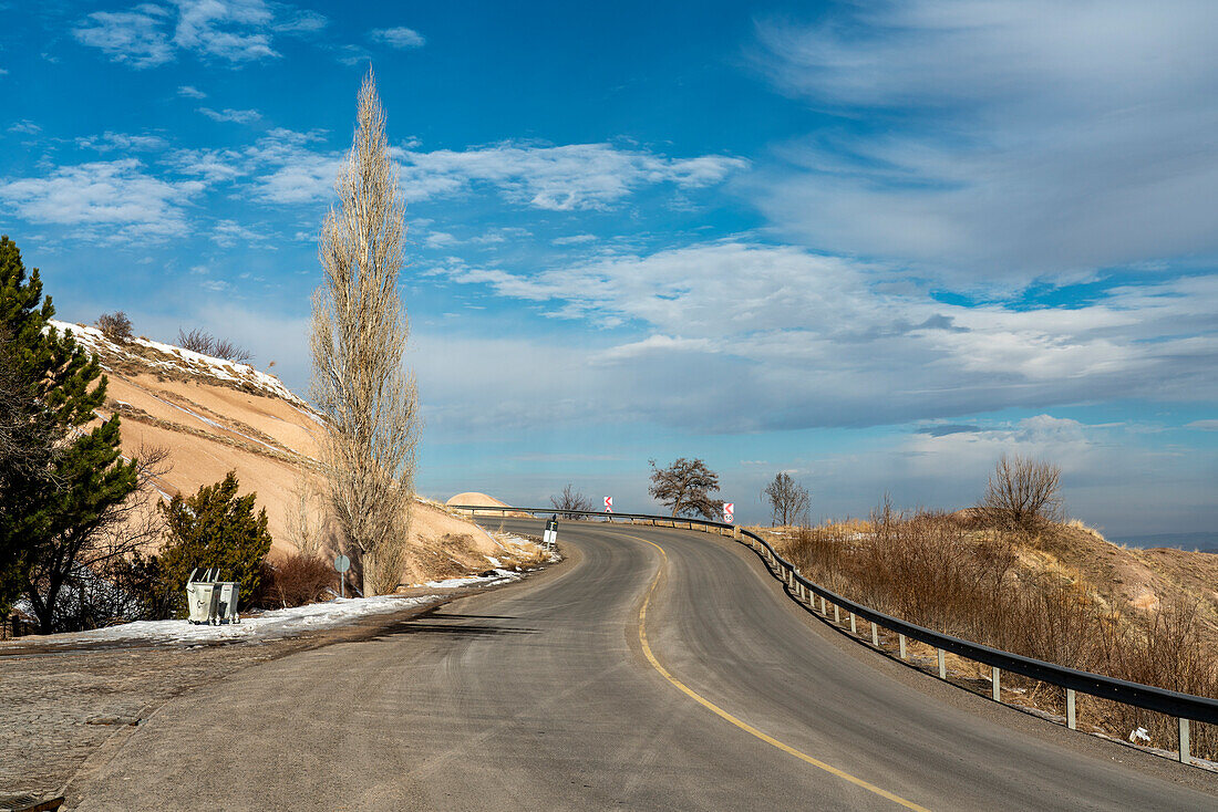 Turkey, Cappadocia, Goreme, Winding road in landscape