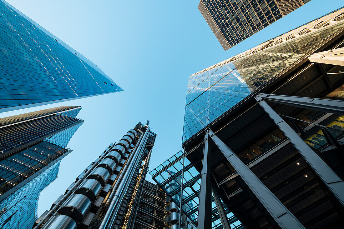 UK, London, Lloyds building and other skyscrapers seen from below