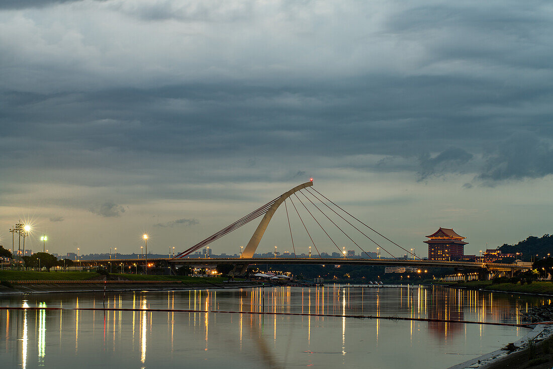 View of illuminated Tamsui Lover's Bridge in Taipei