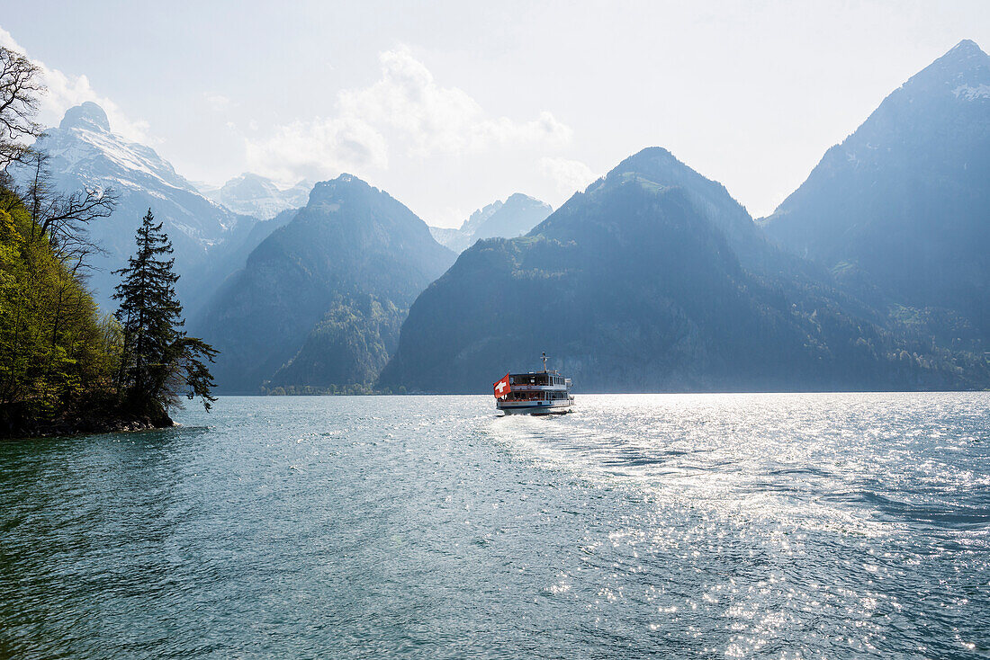 Panorama with lake and mountains and scheduled boat, Sisikon, Lake Lucerne, Uri Canton, Switzerland