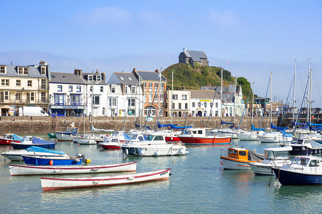 Ilfracombe harbour with yachts and St. Nicholas Chapel overlooking the town of Ilfracombe, Devon, England, United Kingdom, Europe