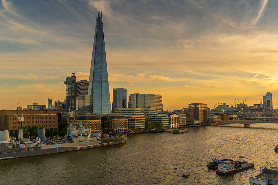 View of The Shard, HMS Belfast and River Thames from Cheval Three Quays at sunset, London, England, United Kingdom, Europe