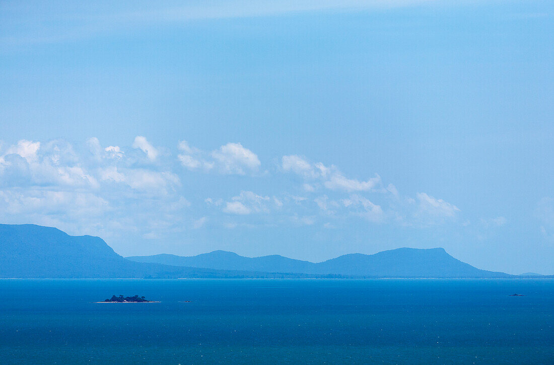 Cambodia, Kep, Blue sky over sea and mountains