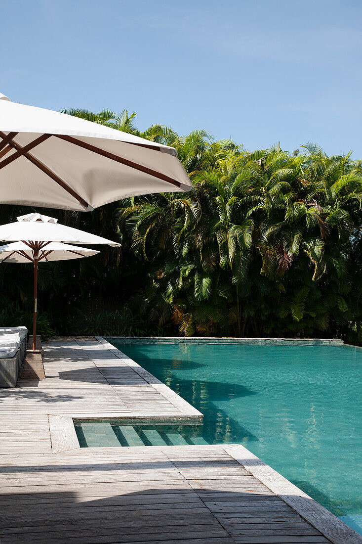 Cambodia, Hotel swimming pool with umbrellas