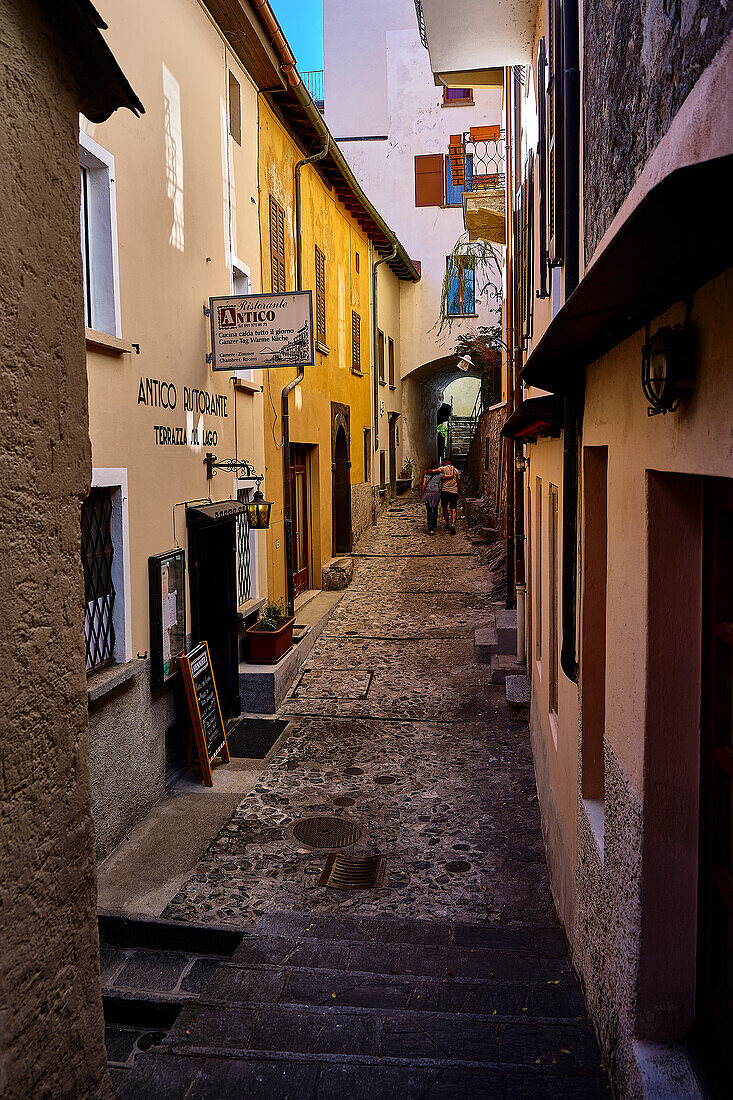 old streets, paths and culverts in the center of Gandria. Whimsical entrance doors and street lamps.