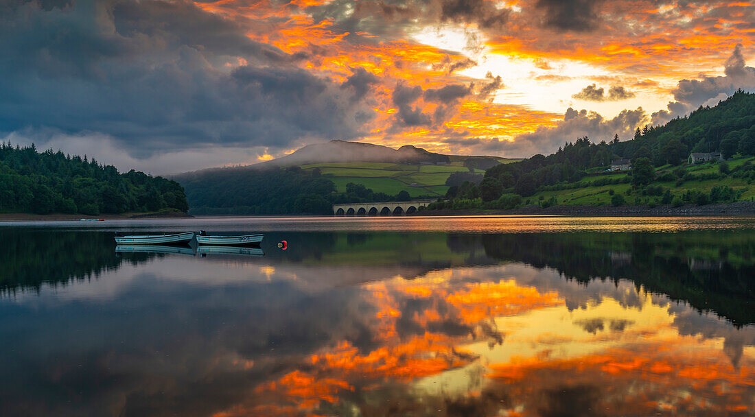 View of dramatic clouds reflecting in Ladybower Reservoir at sunset, Peak District National Park, Derbyshire, England, United Kingdom, Europe