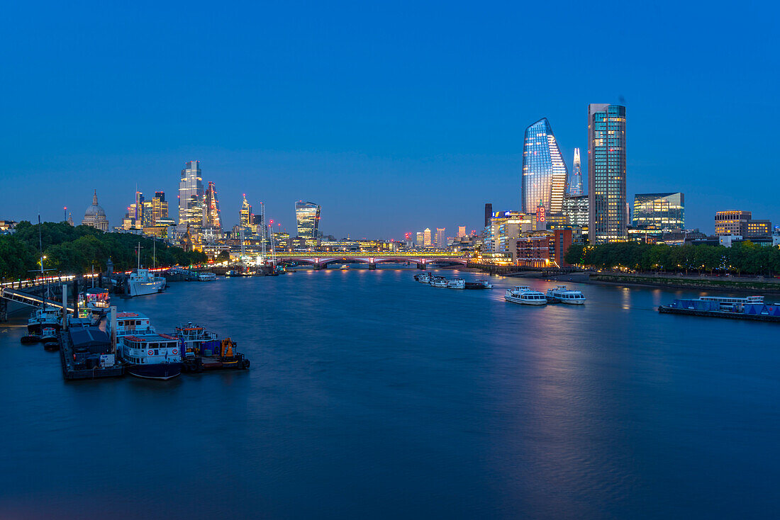 View of Blackfriars Bridge over the River Thames, St. Paul's Cathedral and The City of London skyline at dusk, London, England, United Kingdom, Europe