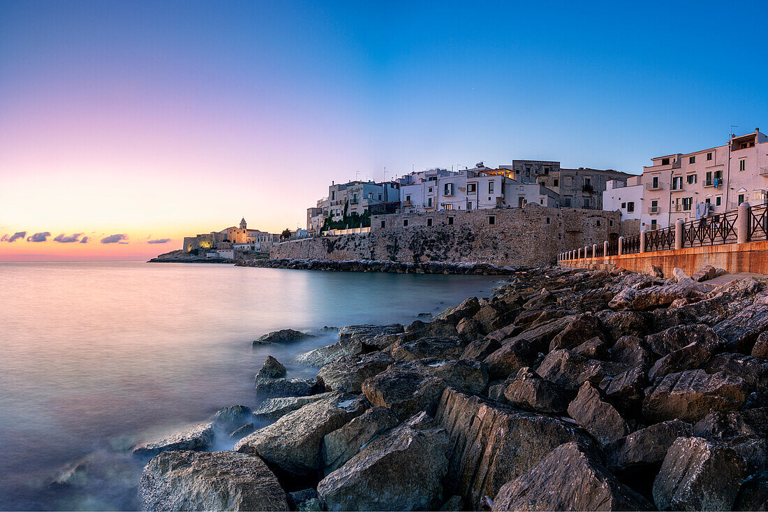 Sunrise over Vieste old town on headland by the sea, Foggia province, Gargano National Park, Apulia, Italy, Europe