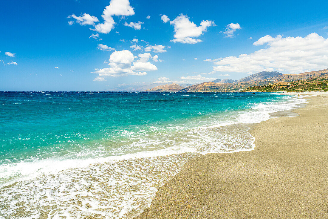 Waves of turquoise clear sea crashing on white sand of Triopetra beach, Plakias, Crete island, Greek Islands, Greece, Europe