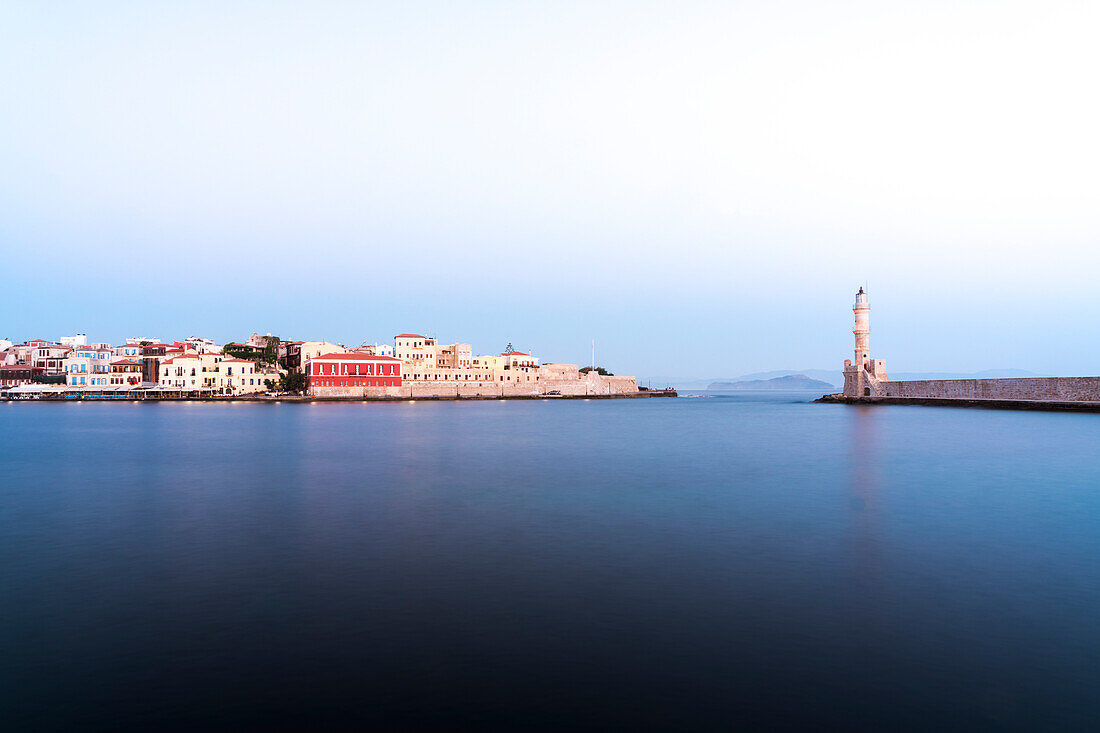 Dusk over the Venetian lighthouse and harbour of Chania old town, Crete, Greek Islands, Greece, Europe
