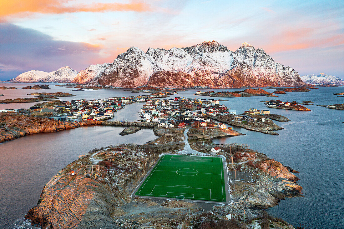 Aerial view of soccer stadium and Henningsvaer village during winter dawn, Nordland county, Lofoten Islands, Norway, Scandinavia, Europe