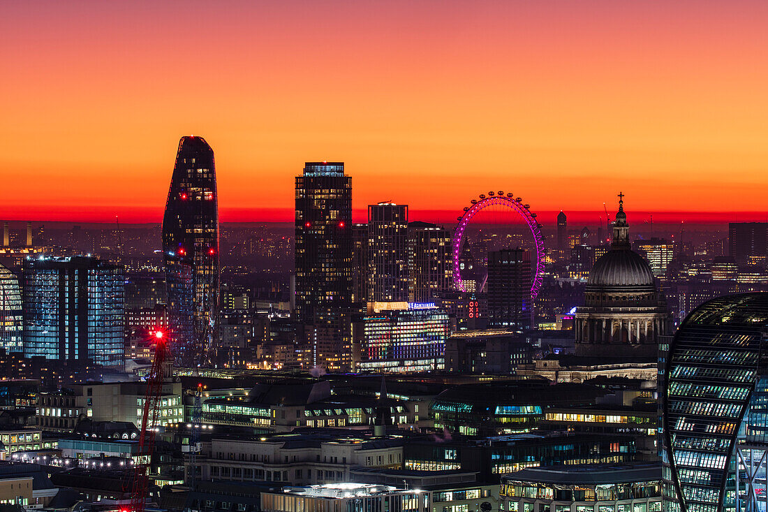 Aerial view of London skyline at sunset, including London Eye and St. Paul's Cathedral, London, England, United Kingdom, Europe