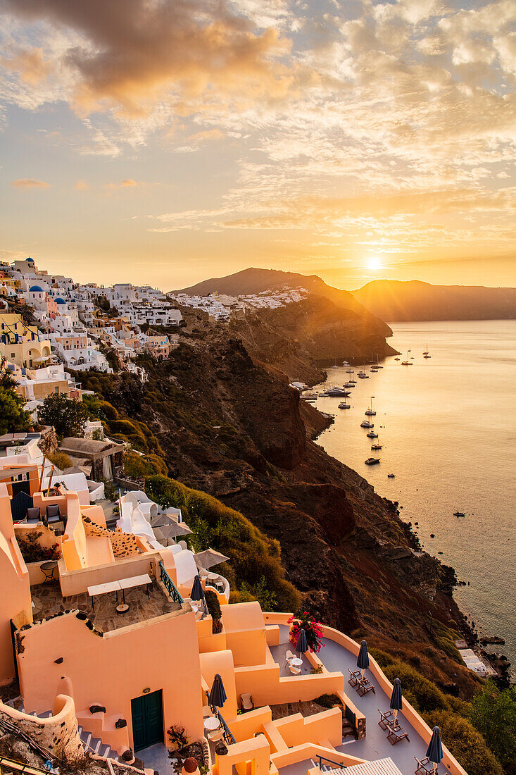 Sunrise over coastline of Oia, Santorini, Cyclades, Greek Islands, Greece, Europe