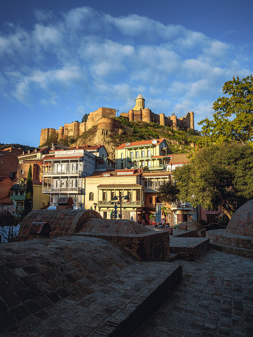 View of the Sulfur Baths with Narikala Fortress at sunrise, Tbilisi, Georgia (Sakartvelo), Central Asia, Asia