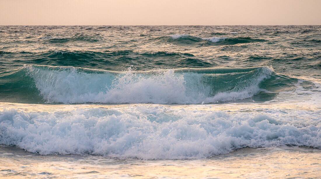 Sea waves at sunset