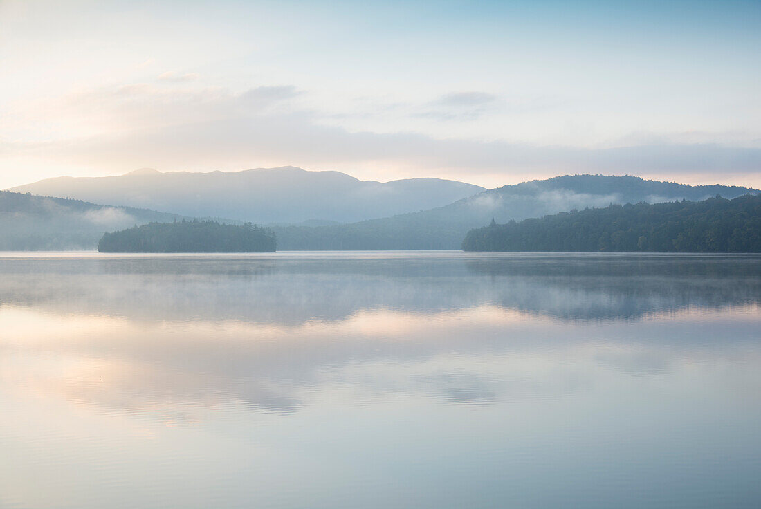 Usa, New York State, North Elba, Morning fog over Placid Lake