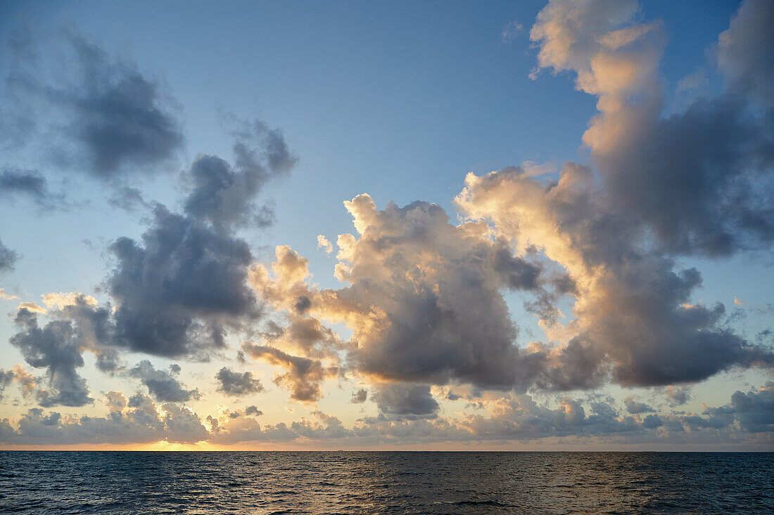 Clouds over ocean at sunrise