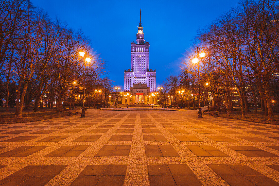 Poland, Masovia, Warsaw, Illuminated high rise building at town square