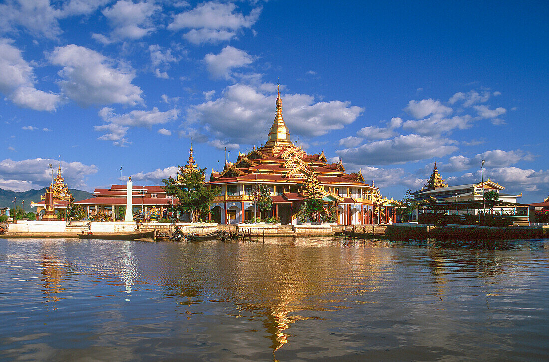 Myanmar, Shan State, Inle Lake, Buddhist temple reflecting in lake