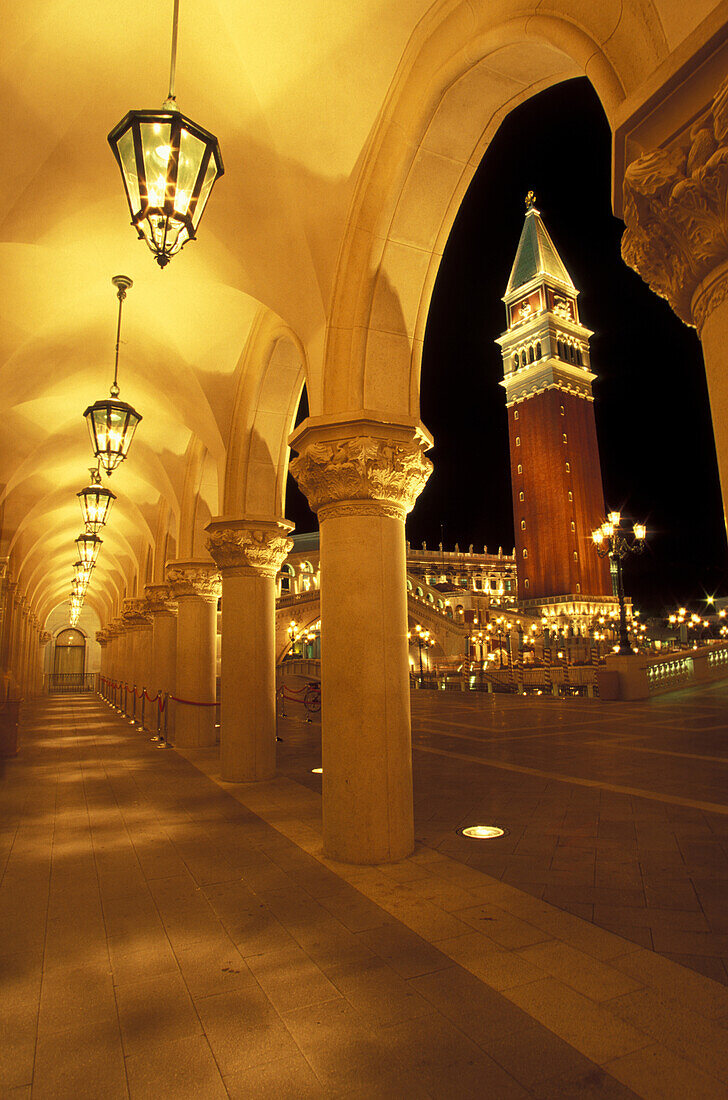 Italy, Venice, Veneto, San Marco Campanile seen from arcade at night