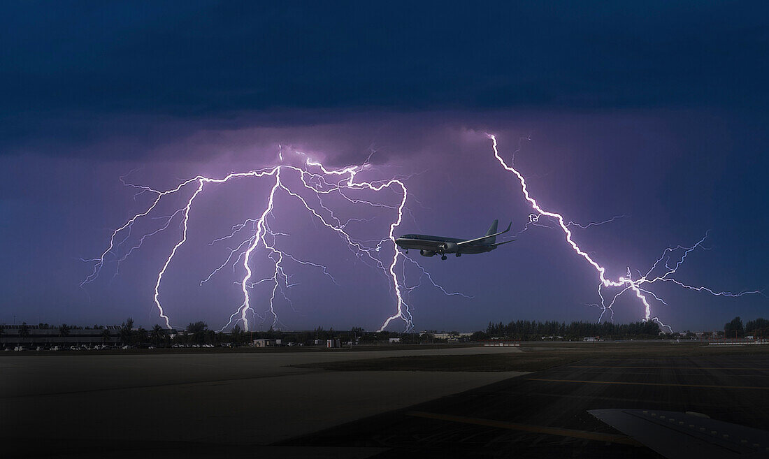 USA, Florida, Miami, Commercial jet landing in thunderstorm