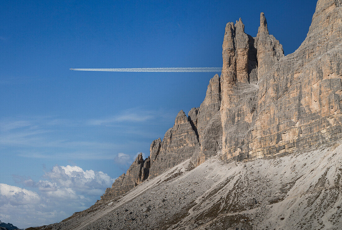 Italy, Veneto, Dolomites, Commercial jet flying over Dolomites