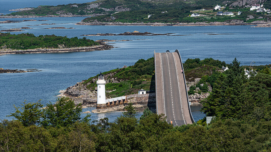 The Skye Bridge over Loch Alsh, connecting the Isle of Skye to Eilean Ban and the mainland, with Kyleakin Lighthouse on the island, Inner Hebrides, Scotland, United Kingdom, Europe