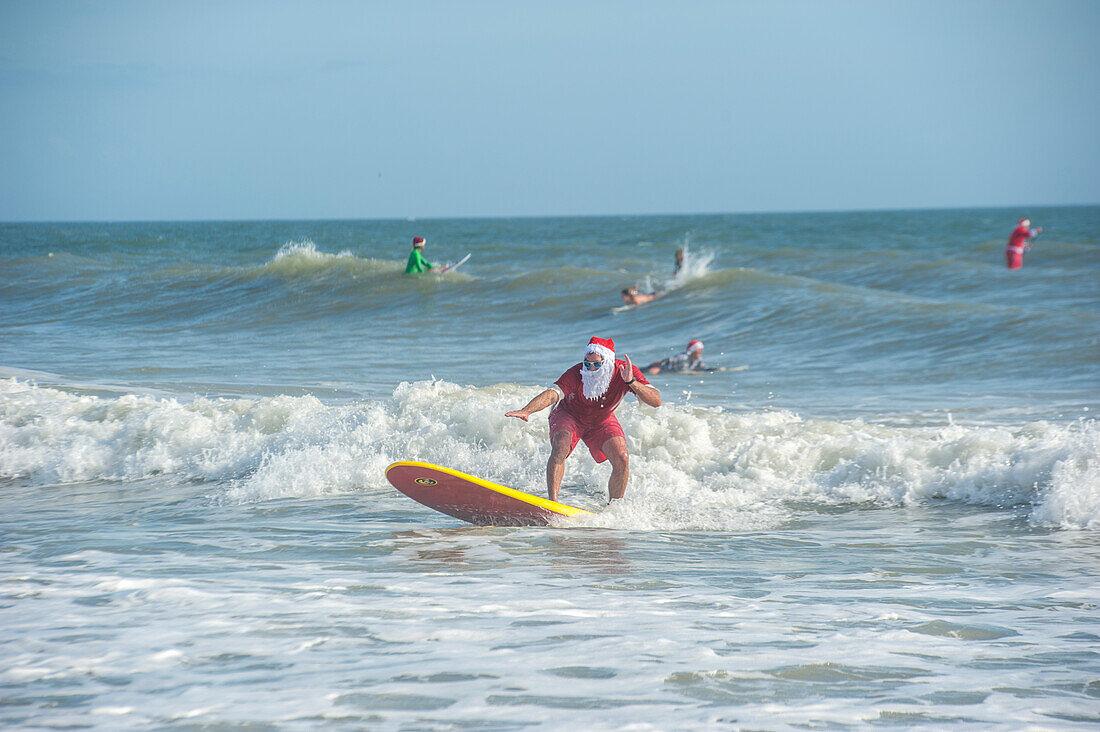 Surfing Santas, Cocoa Beach, Florida, USA
