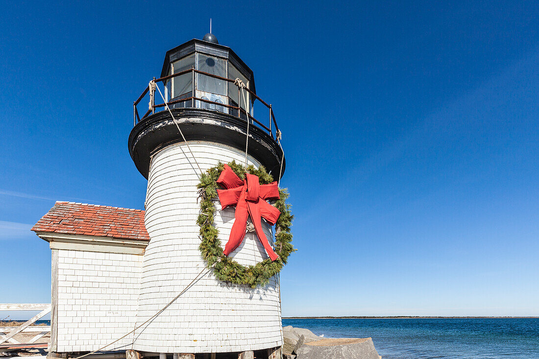 USA, Massachusetts, Nantucket Island. Nantucket Town, Brant Point Lighthouse with a Christmas wreath.