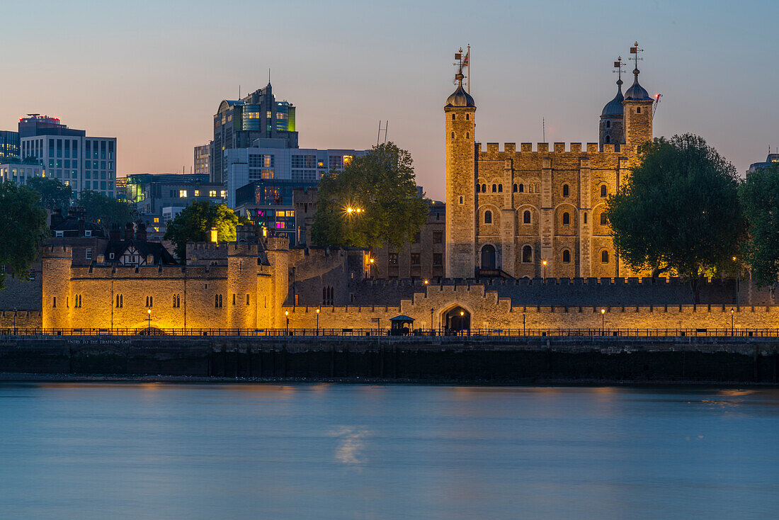 View of the Tower of London, UNESCO World Heritage Site, and River Thames at dusk, London, England, United Kingdom, Europe