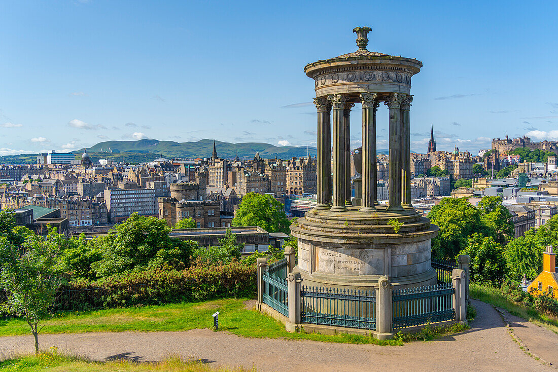 View of city centre skyline and Dugald Stewart Monument, Edinburgh, Scotland, United Kingdom, Europe