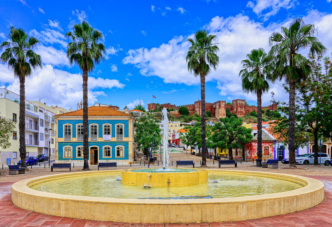 Fountain with a view of the Silves fortress, Algarve, Portugal, Europe