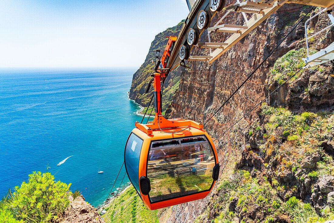 Cable car descending the steep ravine down to the sea, Camara de Lobos, Madeira island, Portugal, Atlantic, Europe