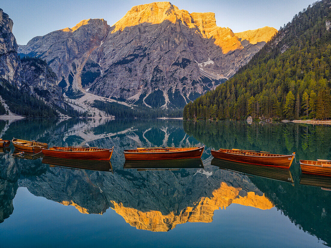 Lake Braies, Croda del Becco reflected in Lake Braies at sunrise, South Tyrol, Alto Adige, Dolomites, Italy, Europe