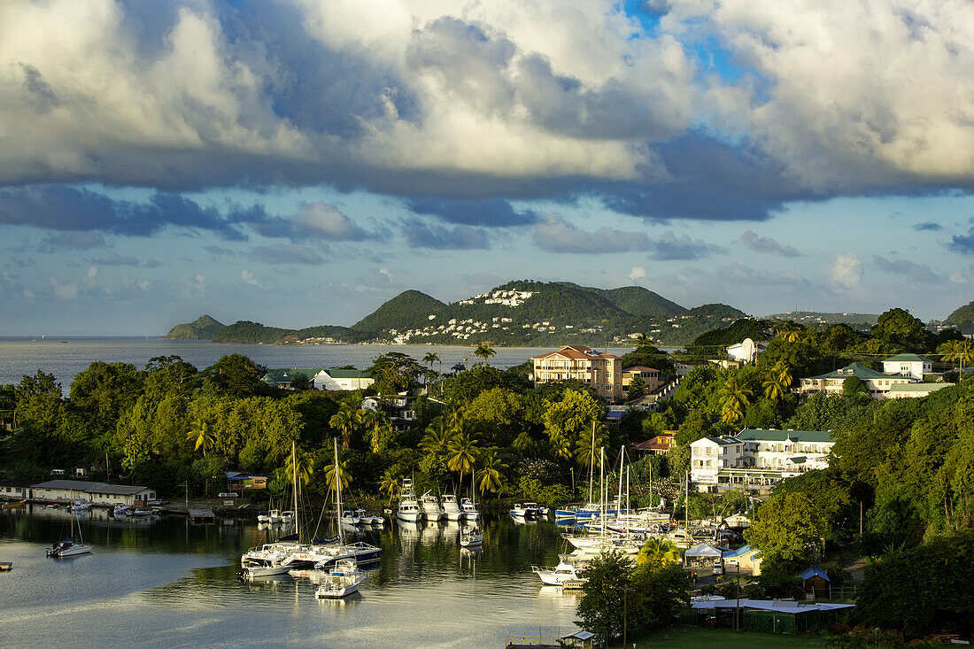 Setting sunlight over the tiny harbor in Castries, St Lucia, West Indies