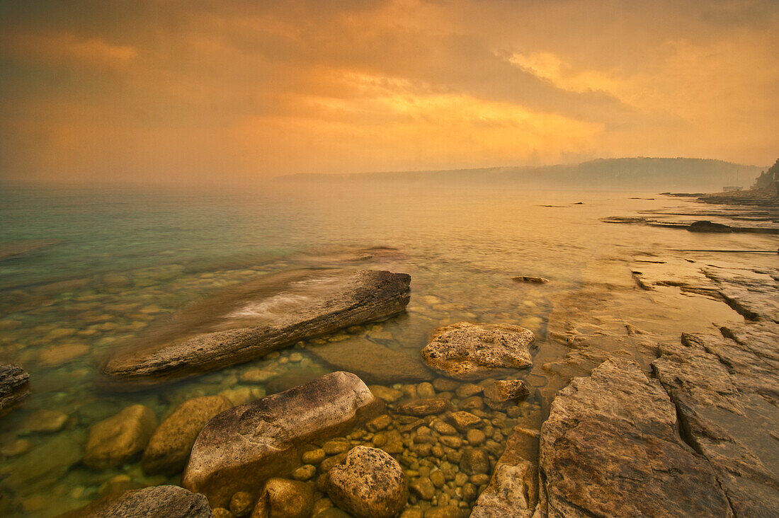 Canada, Ontario, Morning fog on Georgian Bay. Limestone Rock. Barrow Bay. Bruce Peninsula.