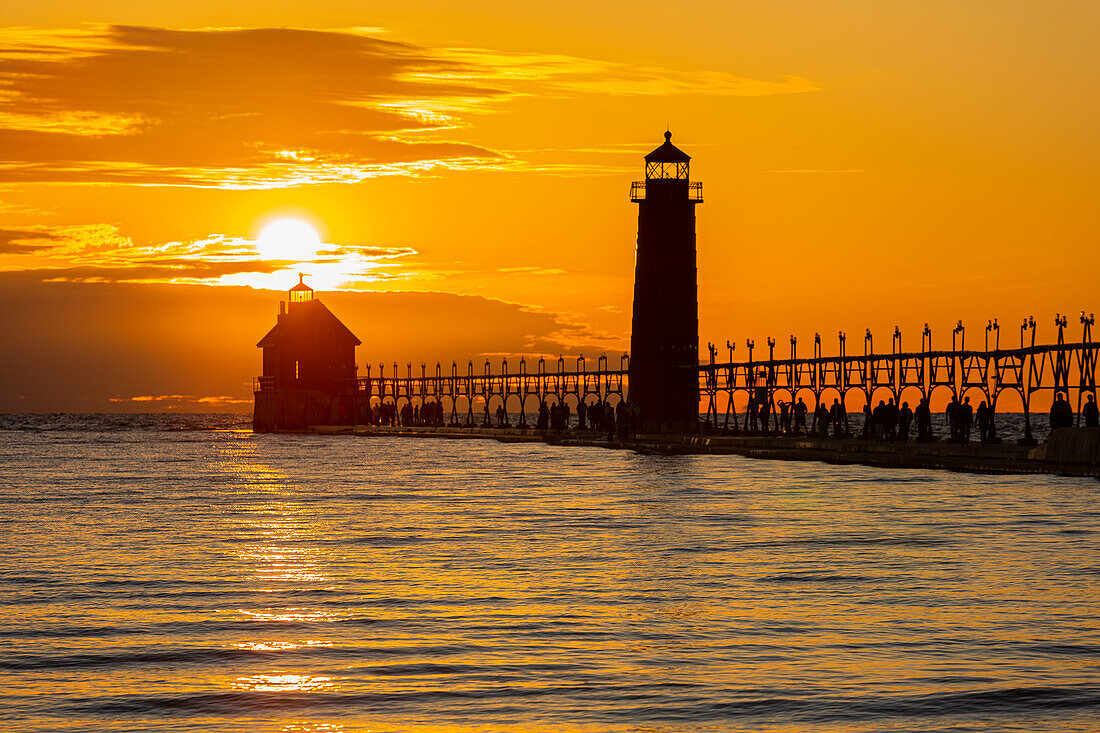 Grand Haven Lighthouse at sunset on Lake Michigan, Grand Haven, Michigan.