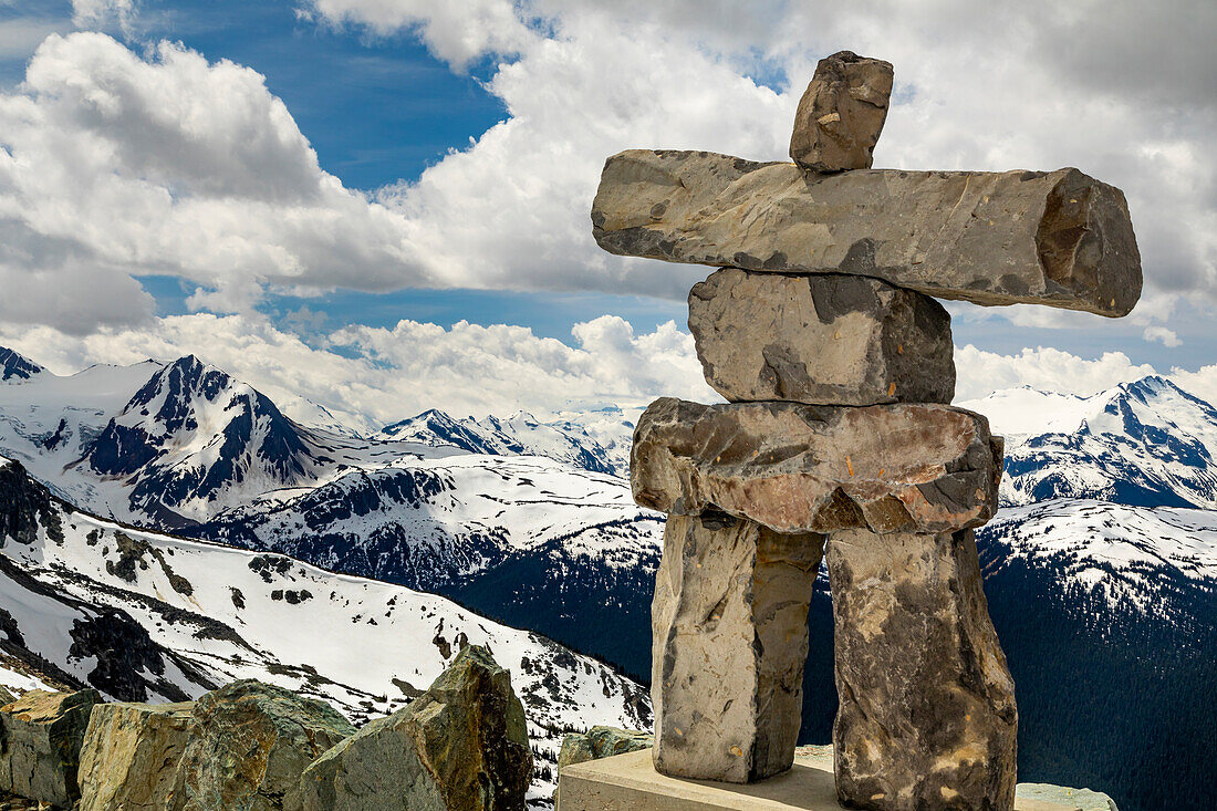 Canada, British Columbia Garibaldi Provincial Park. Inukshuk stone figure close-up and mountains