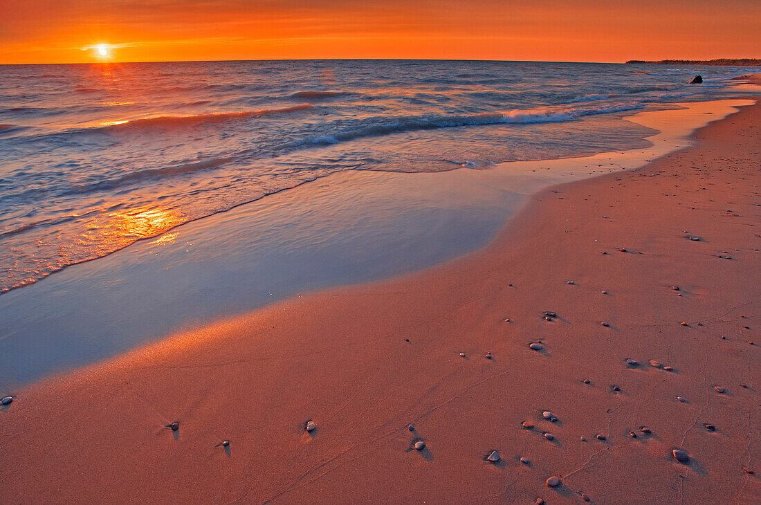 Canada, Ontario, Grand Bend. Sandy beach on Lake Huron at sunset