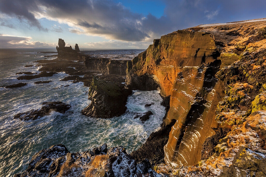 Dramatic cliffs at Londrangar sea stacks in the North Atlantic ocean on the Snaefellsnes peninsula in western Iceland