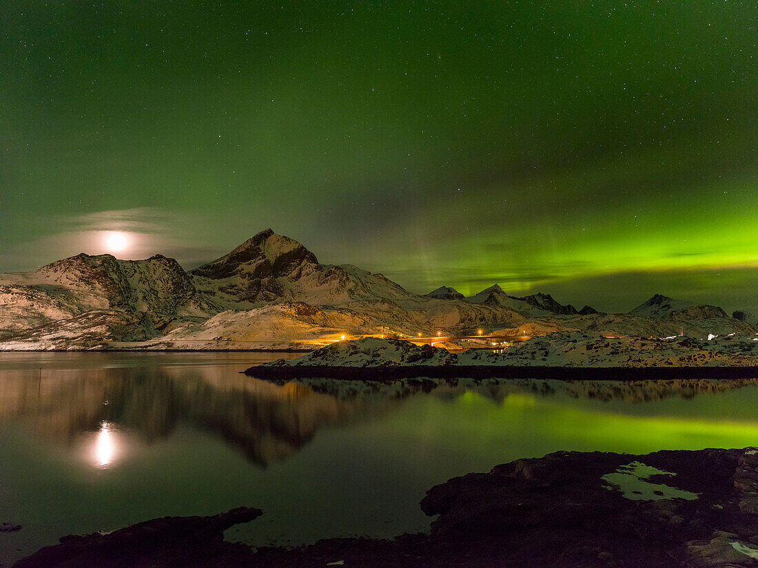 Aurora Borealis. View from Flakstadoya towards Moskenesoya with the bridge over the Kakersundet. The Lofoten Islands in northern Norway during winter. Scandinavia, Norway