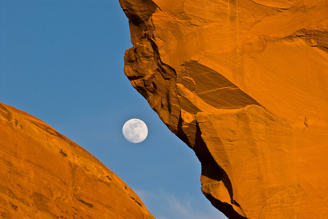 USA, Utah. Looking through Skyline arch at full moon, Arches National Park