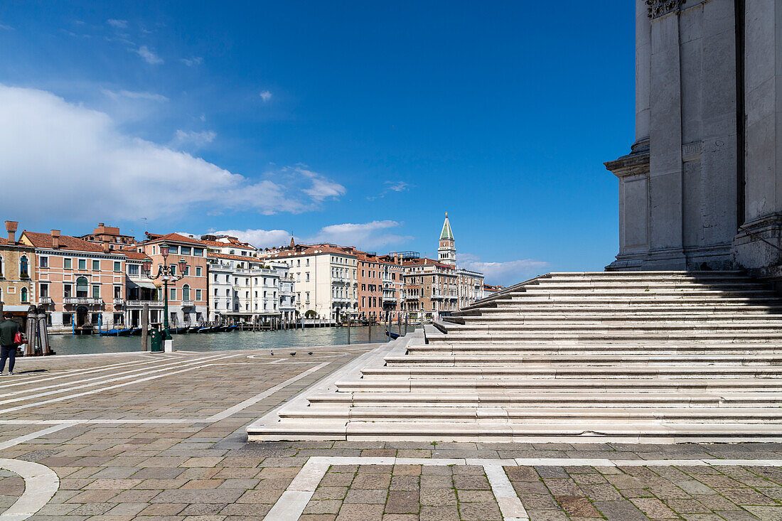 The staircase of the Basilica della Salute. In the background the palaces on the Grand Canal, Venice, Veneto, Italy.