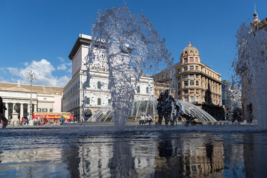 Reflections in the fountain of Piazza de Ferrari, Genoa, Liguria, Italy.