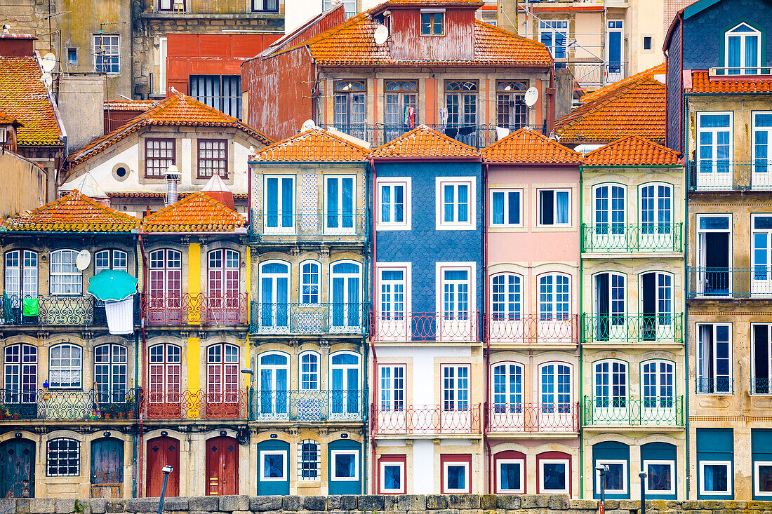 Europe, Portugal, Porto. Colorful building facades next to Douro River