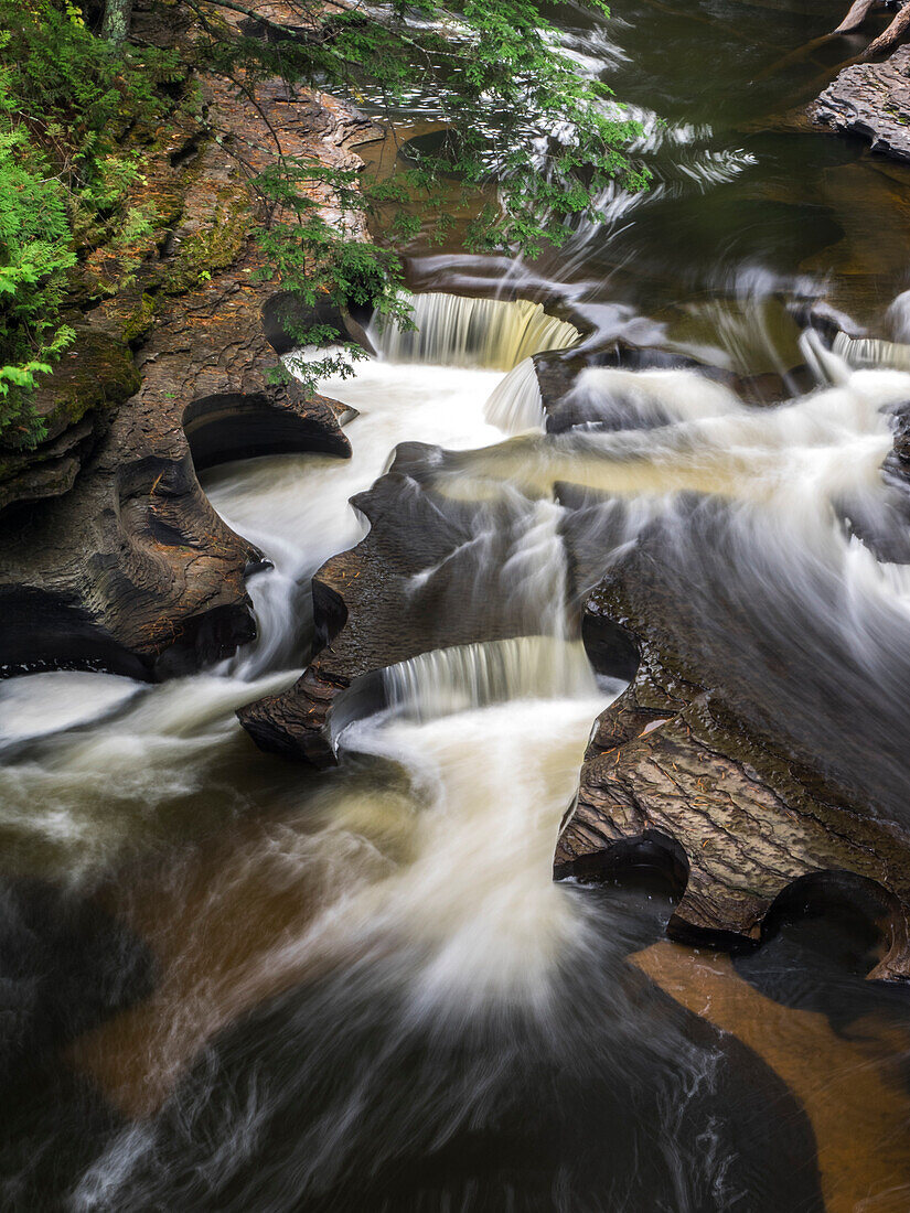 US, Michigan, Upper Peninsula. The Wild and Scenic Presque Isle River creates these Potholes among the Nonesuch Shale in Michigan's Upper Peninsula.