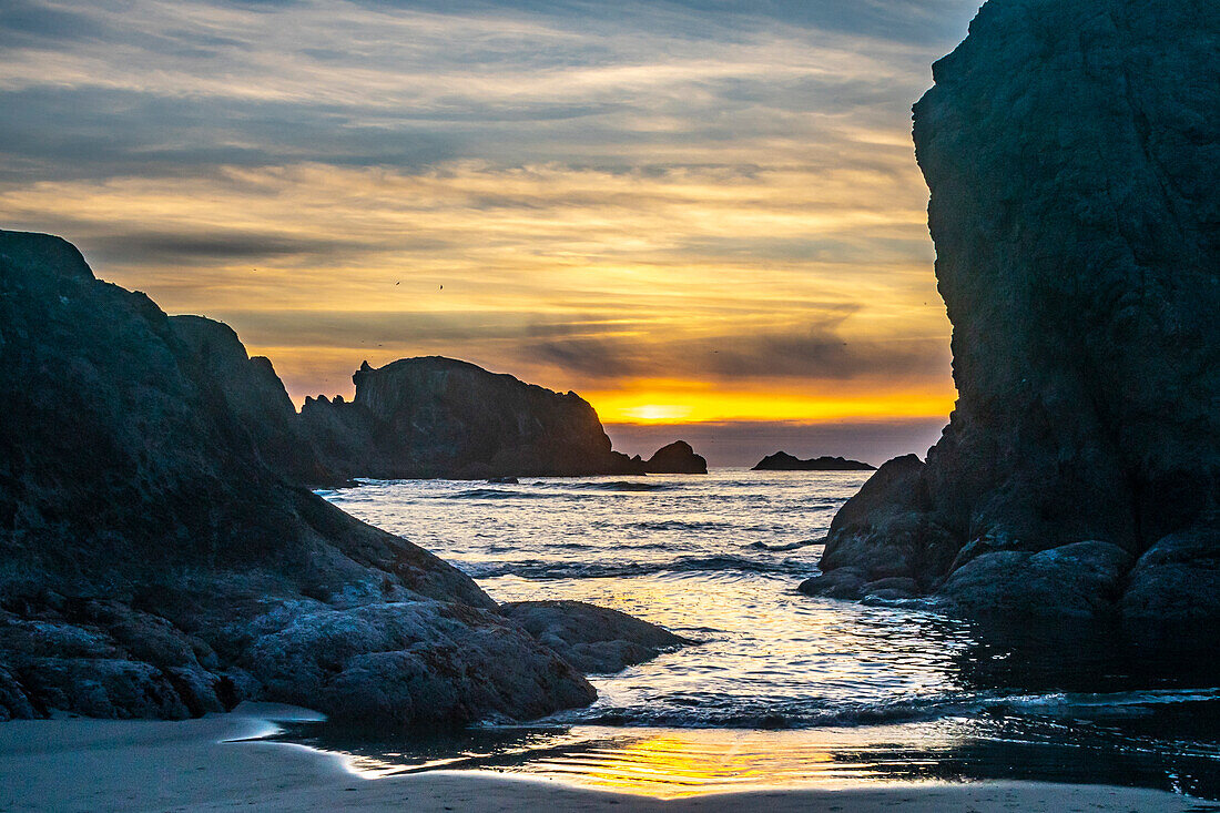 USA, Oregon, Bandon Beach. Pacific Ocean sea stacks at sunset.