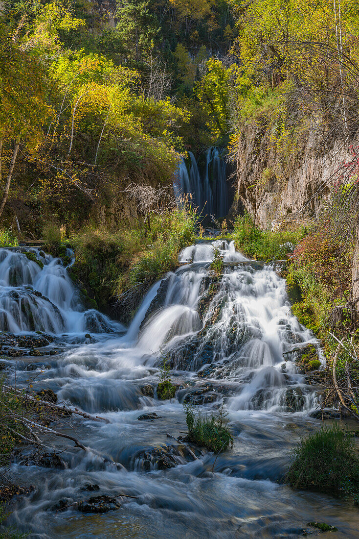 Vertical scenic of Roughlock Falls and autumn foliage, Spearfish Canyon, South Dakota, Black Hills